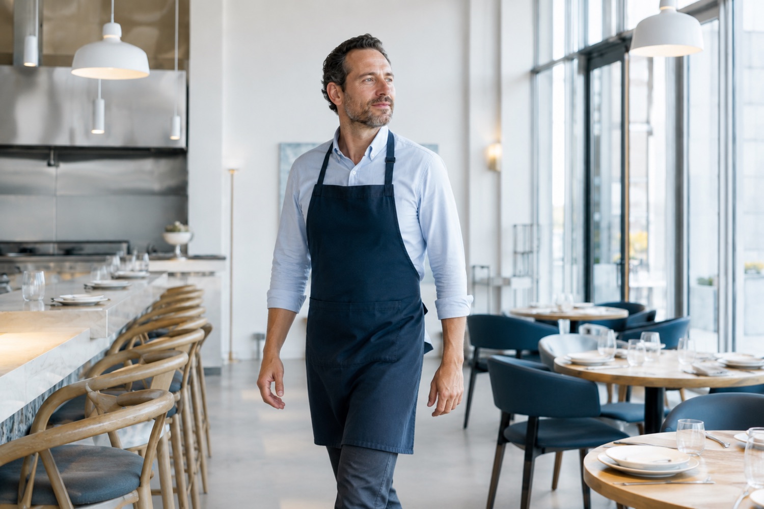 A venue owner walking through their dining room before service