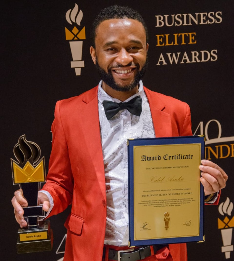 Caleb Azuka, founder of Hospitality Shield, holding his 2023 Business Elite 40 Under 40 award trophy and certificate